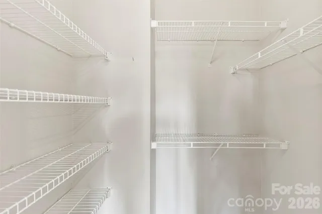 a view of a room with racks on the wall