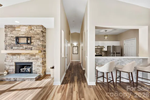 a view of a livingroom with furniture and a fireplace
