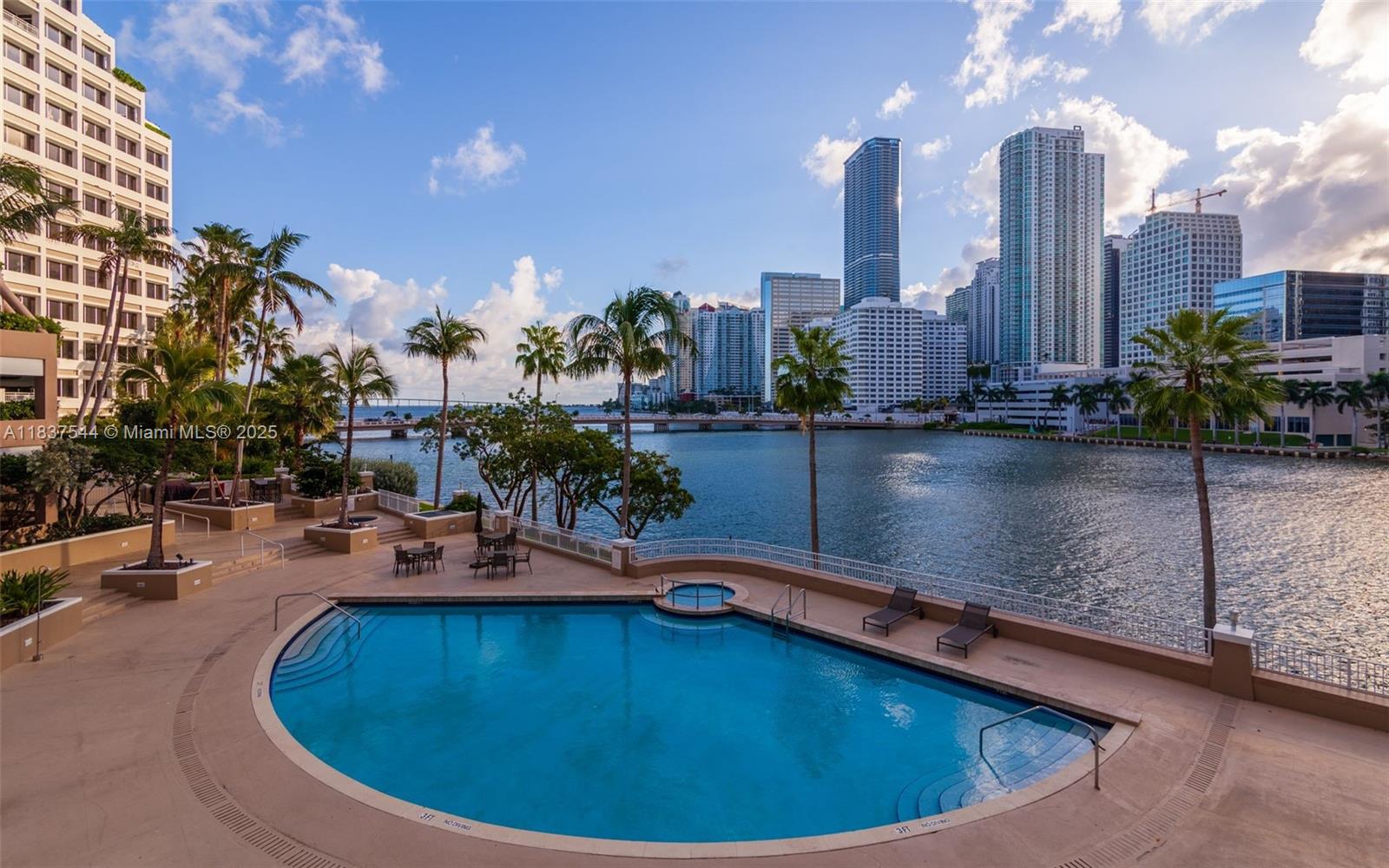 701 Brickell Key Boulevard, Unit 2011 Miami, FL 33131 - Photo 17 of 24 a view of a swimming pool with outdoor seating