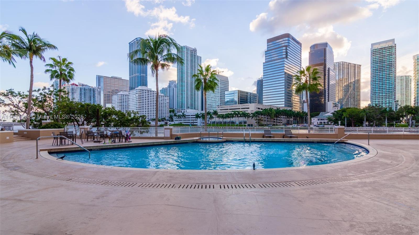 701 Brickell Key Boulevard, Unit 2011 Miami, FL 33131 - Photo 18 of 24 a view of a swimming pool next to a building