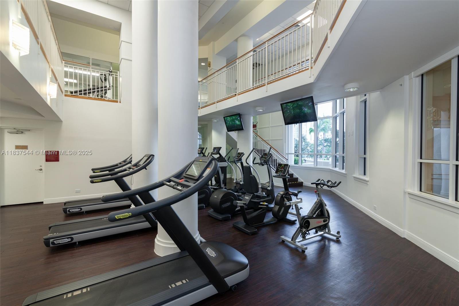 701 Brickell Key Boulevard, Unit 2011 Miami, FL 33131 - Photo 19 of 24 a view of a room with gym equipment