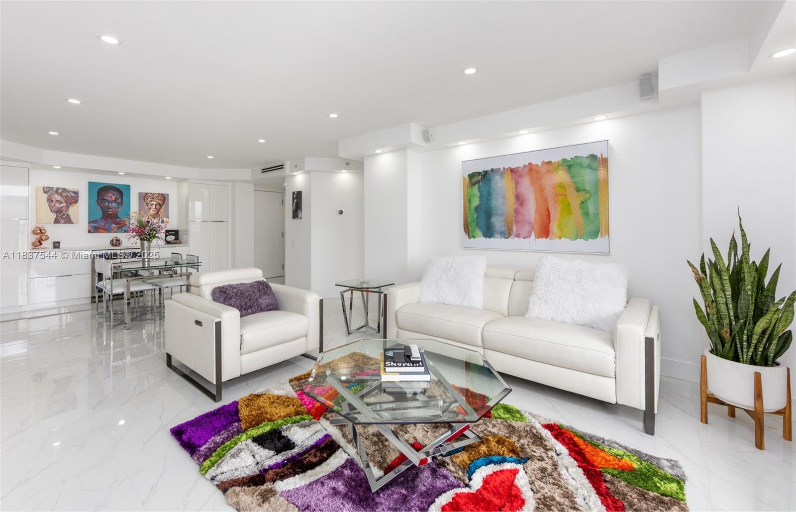 701 Brickell Key Boulevard, Unit 2011 Miami, FL 33131 - Photo 3 of 24 a living room with furniture and painting on the wall