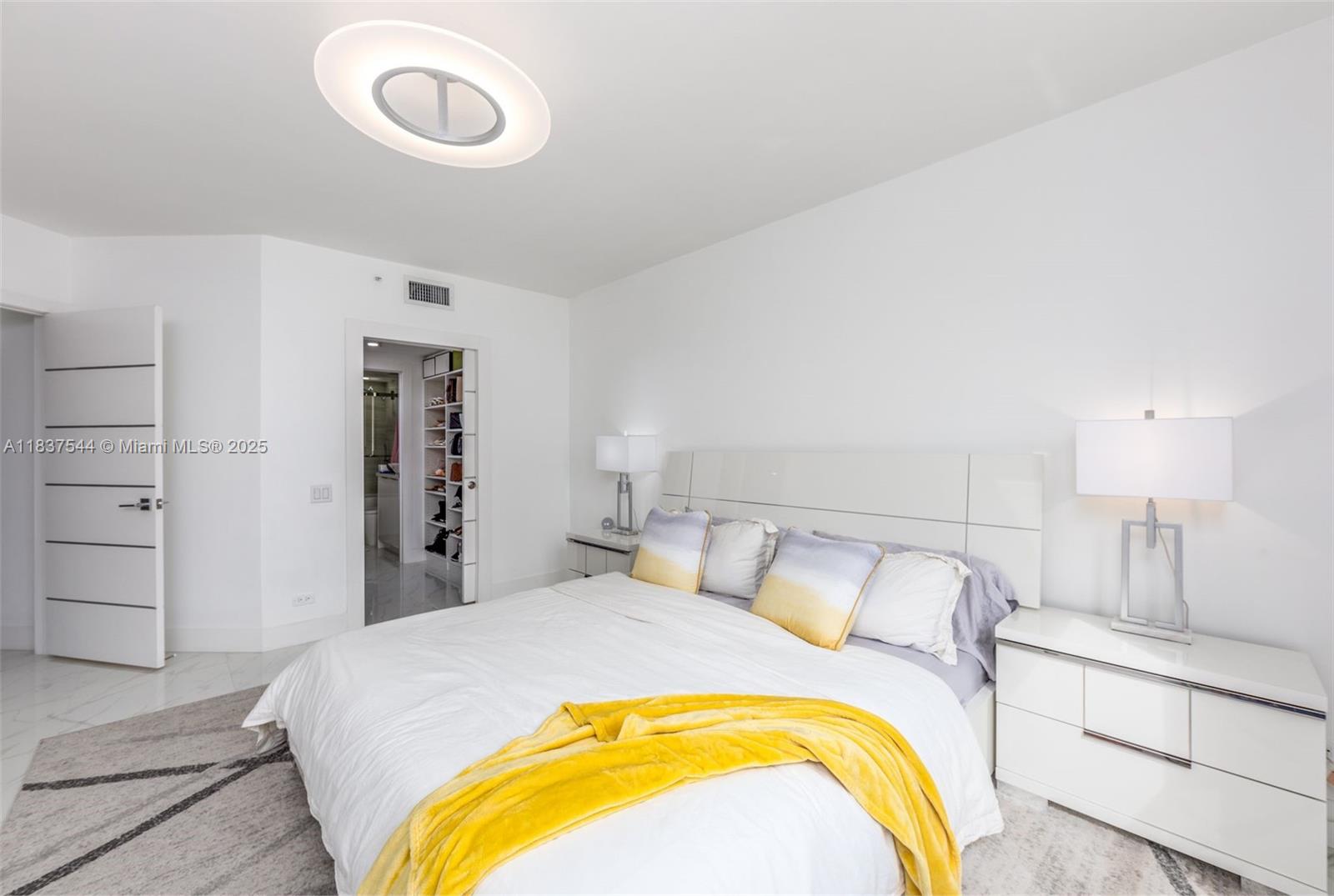 701 Brickell Key Boulevard, Unit 2011 Miami, FL 33131 - Photo 10 of 24 a bedroom with a bed and a closet