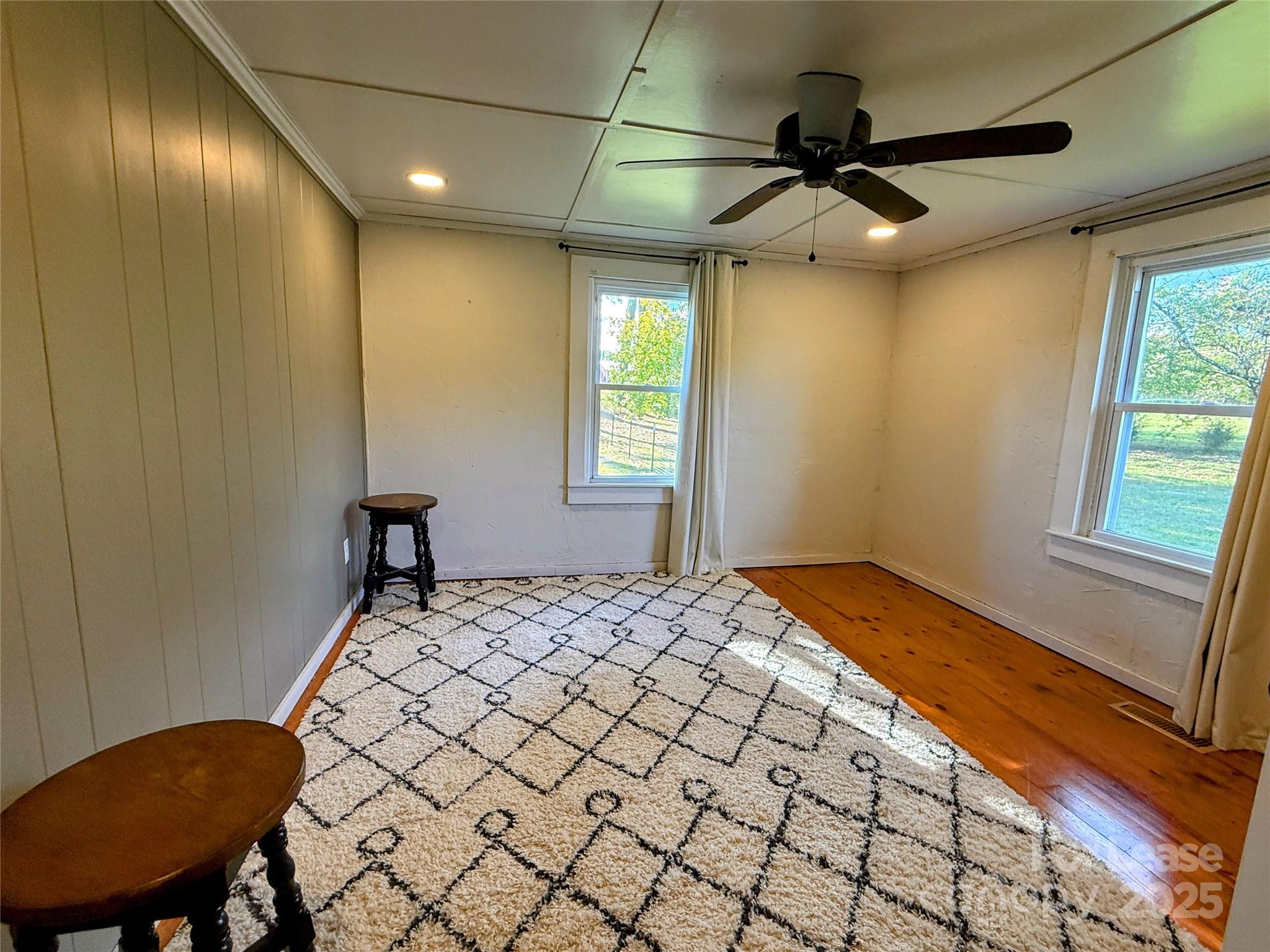 7135 Nc Highway Mill Spring, NC 28756 - Photo 17 of 28 a bedroom with a bed and a window