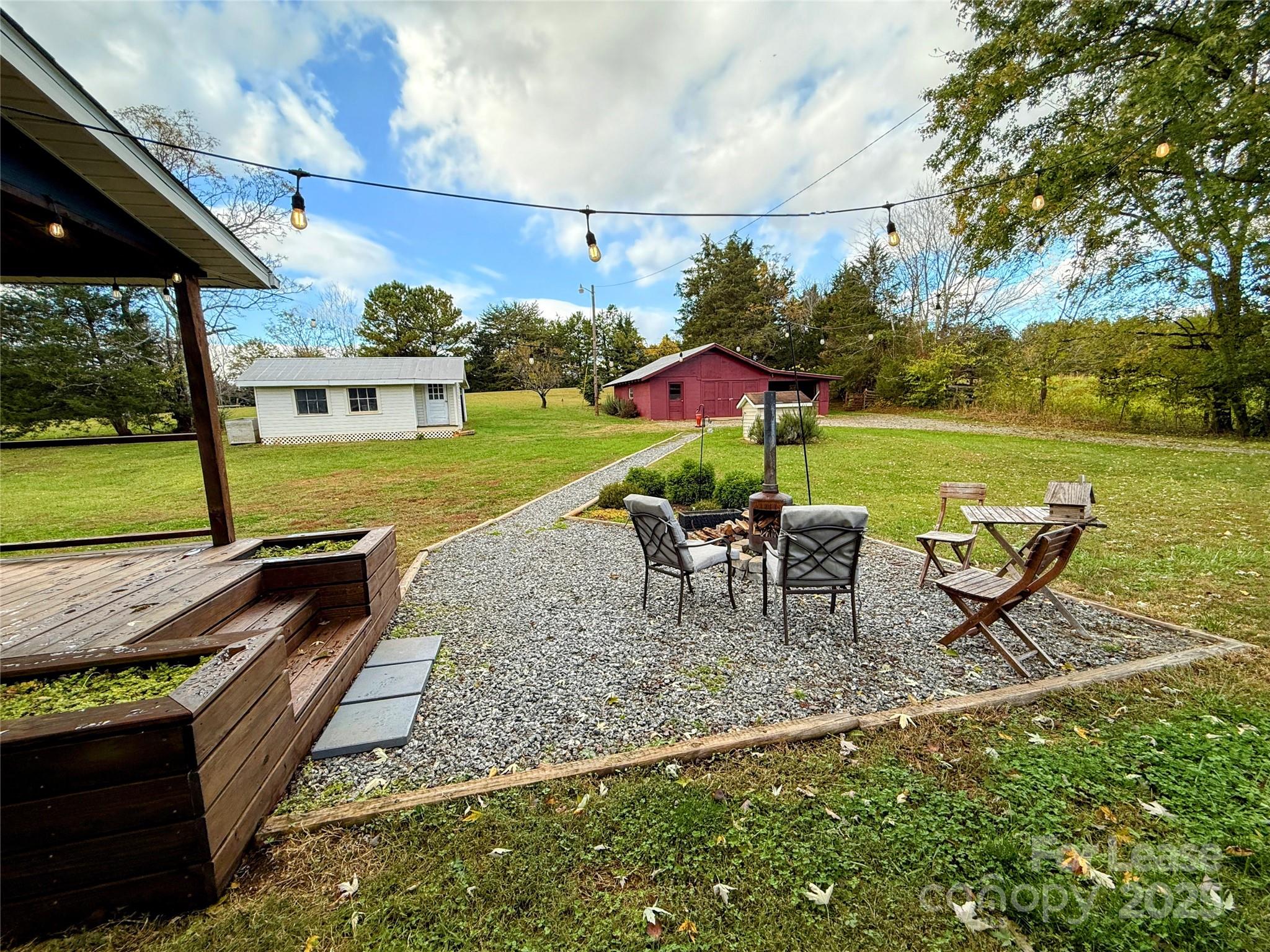 7135 Nc Highway Mill Spring, NC 28756 - Photo 24 of 28 an outdoor space with furniture and garden