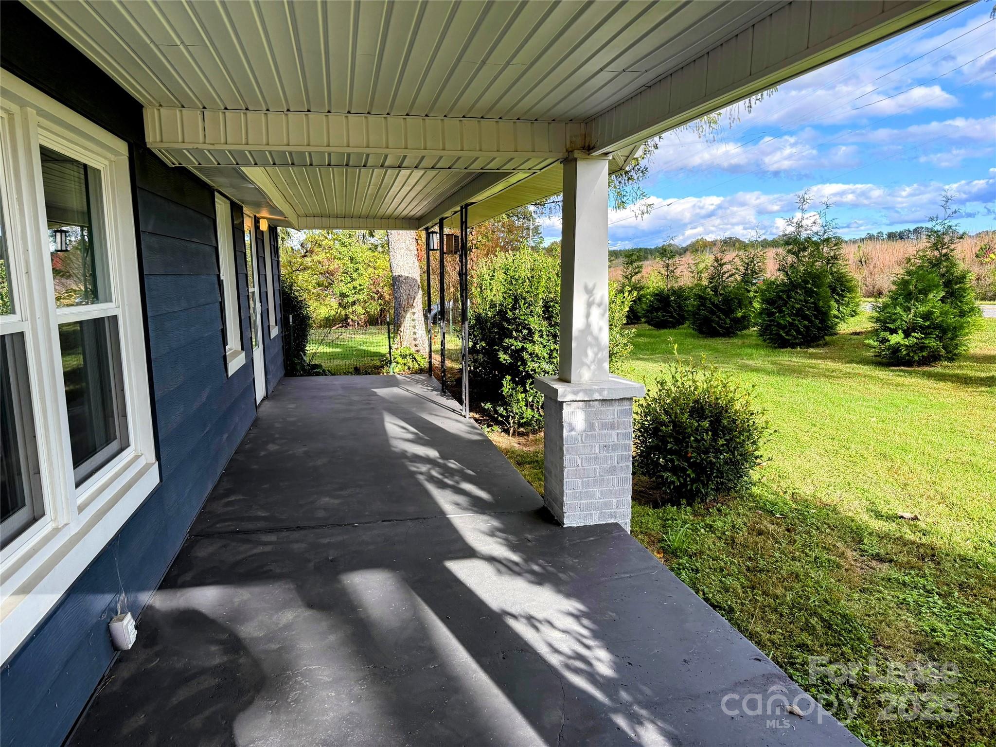 7135 Nc Highway Mill Spring, NC 28756 - Photo 5 of 28 a view of a porch with garden
