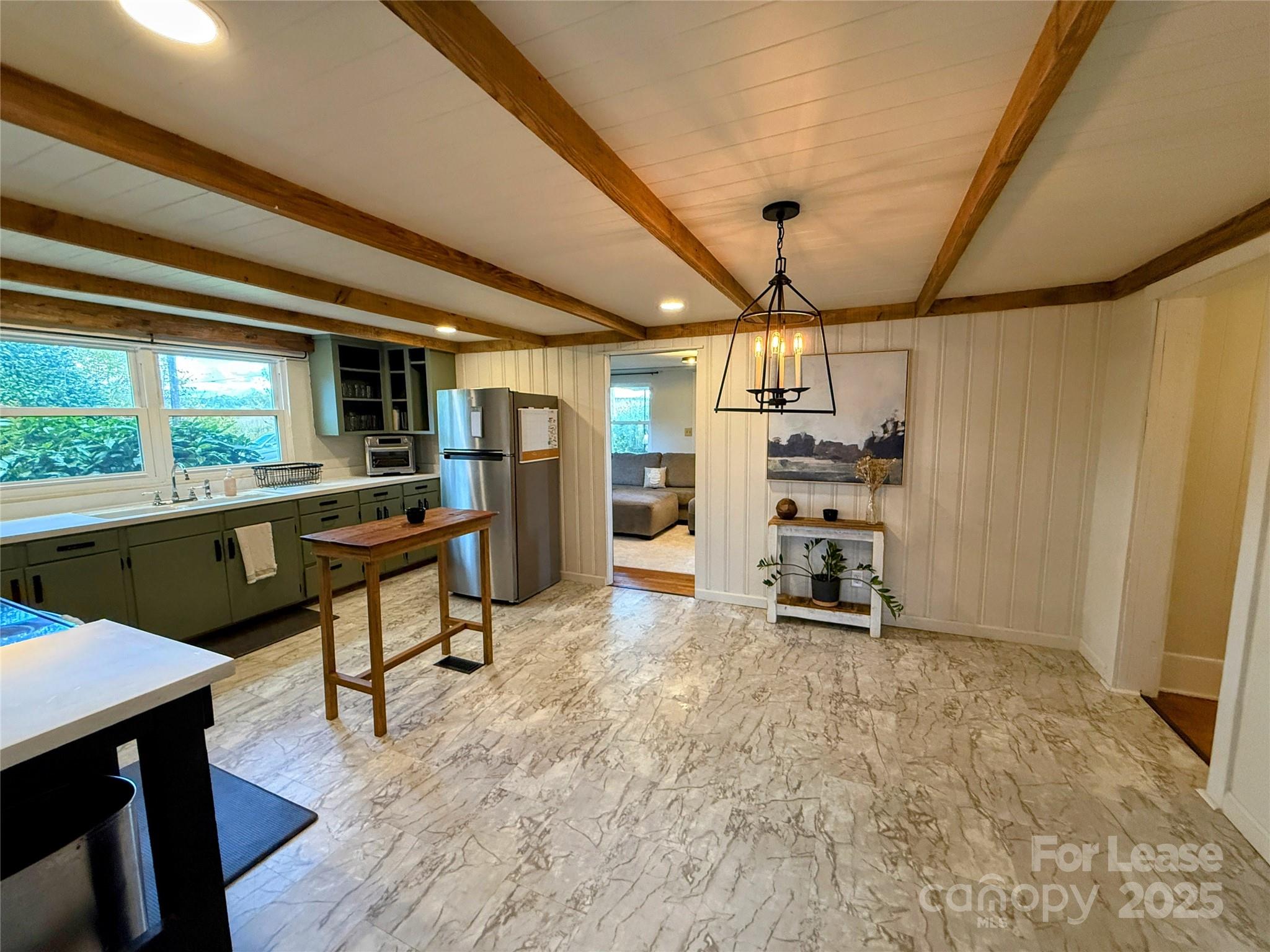 7135 Nc Highway Mill Spring, NC 28756 - Photo 10 of 28 a room with stainless steel appliances kitchen island granite countertop furniture and a kitchen view