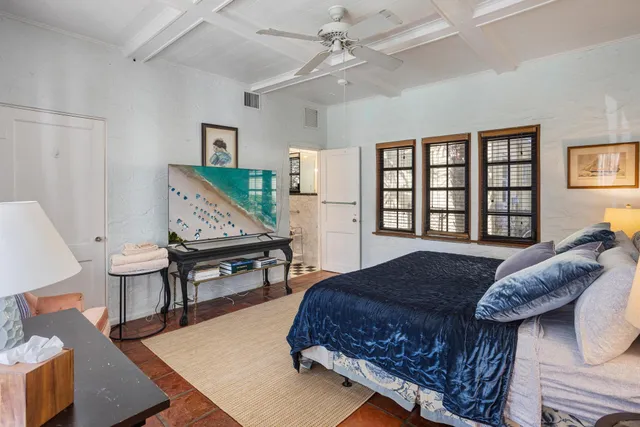 a living room with a bed furniture and a window