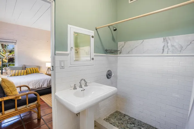 a bathroom with a sink and a mirror