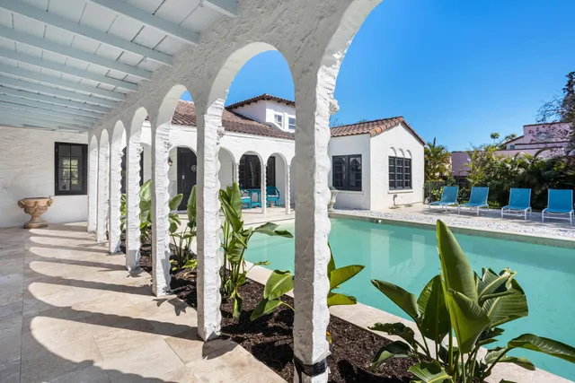 a view of swimming pool with outdoor seating