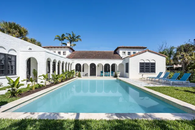 a view of a house with swimming pool