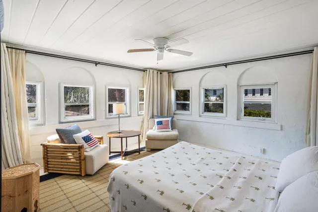 a bedroom with furniture and windows