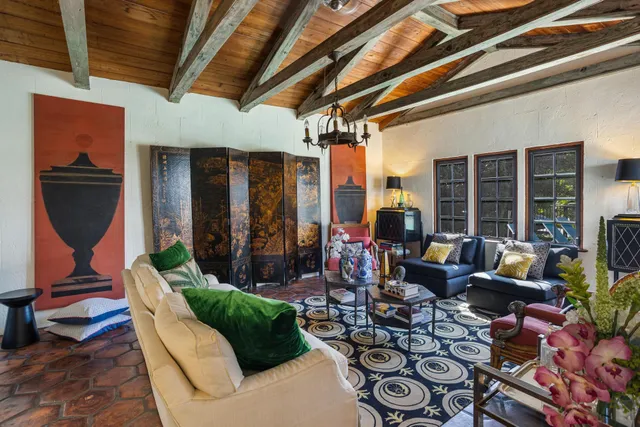 a building outdoor space with patio furniture and potted plants