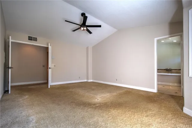 a kitchen with stainless steel appliances granite countertop cabinets and a refrigerator