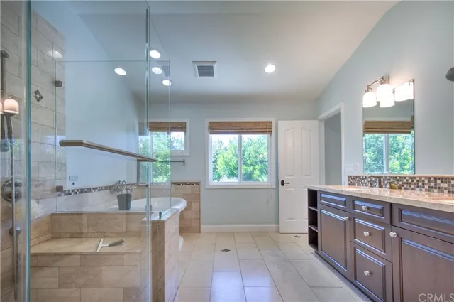 a view of a backyard with sitting area