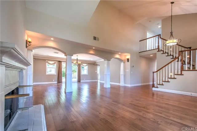a view interior of a house with wooden floor windows and a chandelier