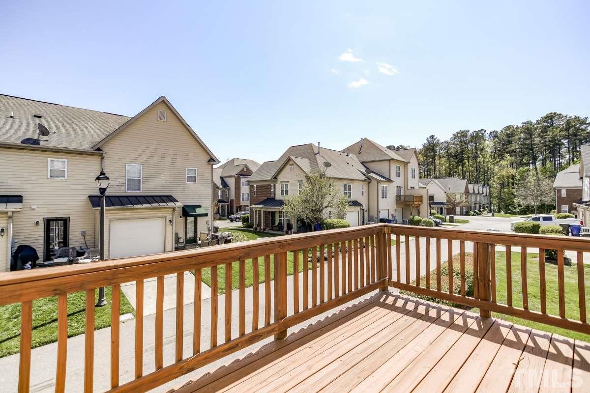 9813 Castain Drive Raleigh, NC 27617 - Photo 15 of 16 a view of a houses with a balcony