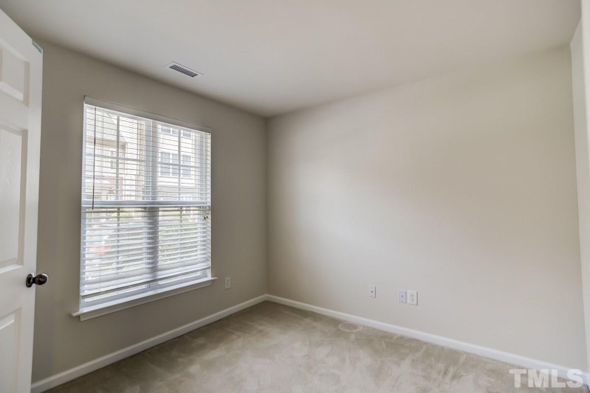 9813 Castain Drive Raleigh, NC 27617 - Photo 3 of 16 a view of an empty room with a window