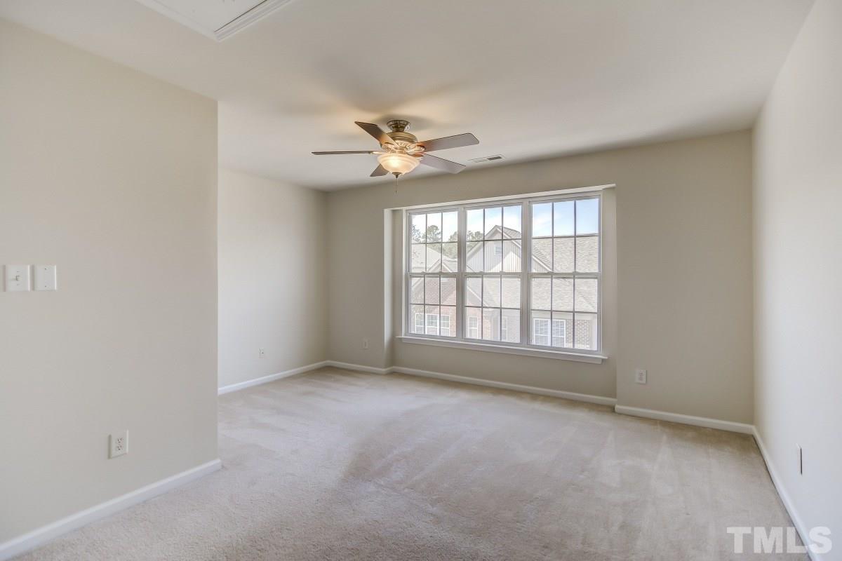 9813 Castain Drive Raleigh, NC 27617 - Photo 9 of 16 a view of an empty room with a window