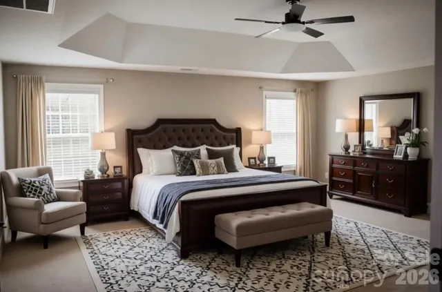 a bedroom with a bed a couch and dresser