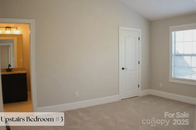 a bathroom with double sink and a mirror
