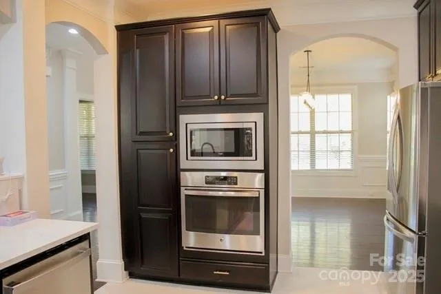 a kitchen with a stove and a refrigerator
