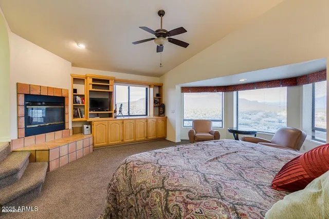 a bedroom with a large bed and a large window