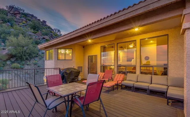 a view of a outdoor seating area with furniture and wooden floor