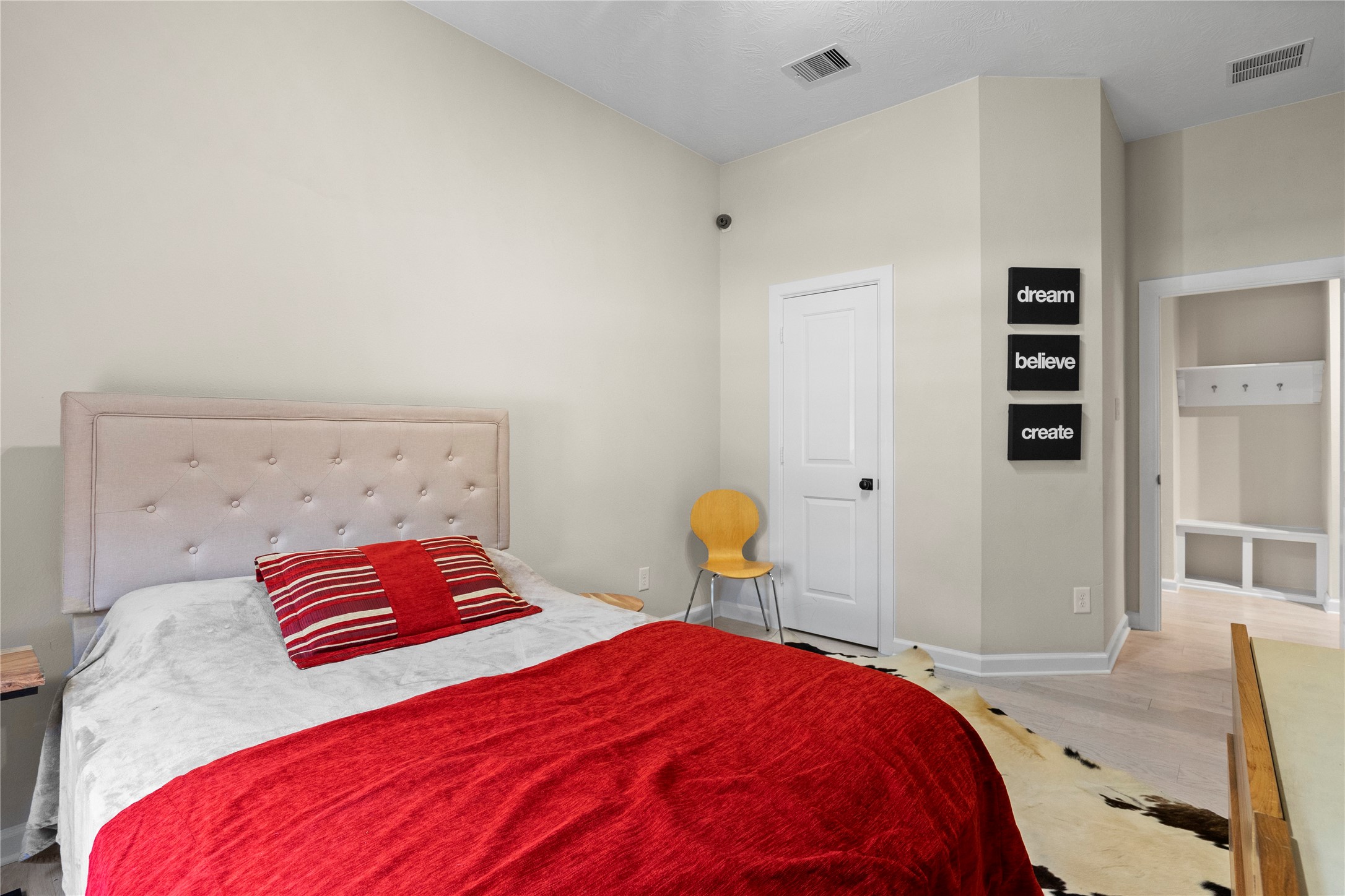 31503 Reston Cliff Court Spring, TX 77386 - Photo 22 of 28 a bedroom with a bed and painting on the wall