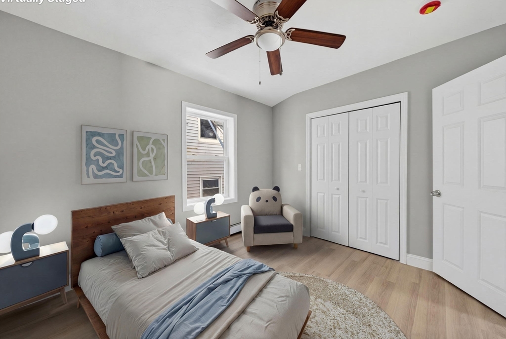 169 Grant Street Fall River, MA 02721 - Photo 20 of 42 a bedroom with furniture and a chandelier