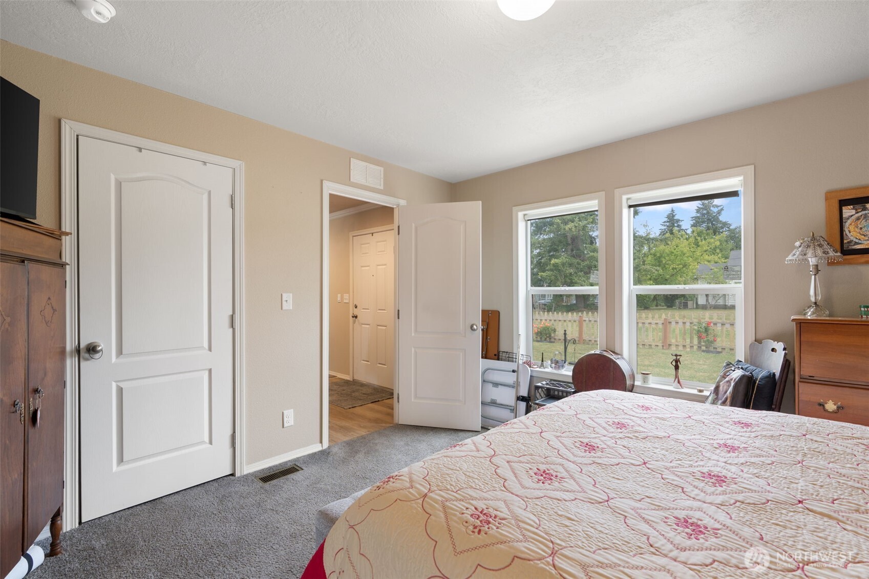 608 Main Street Vader, WA 98593 - Photo 19 of 37 a bedroom with a bed a large window and a television