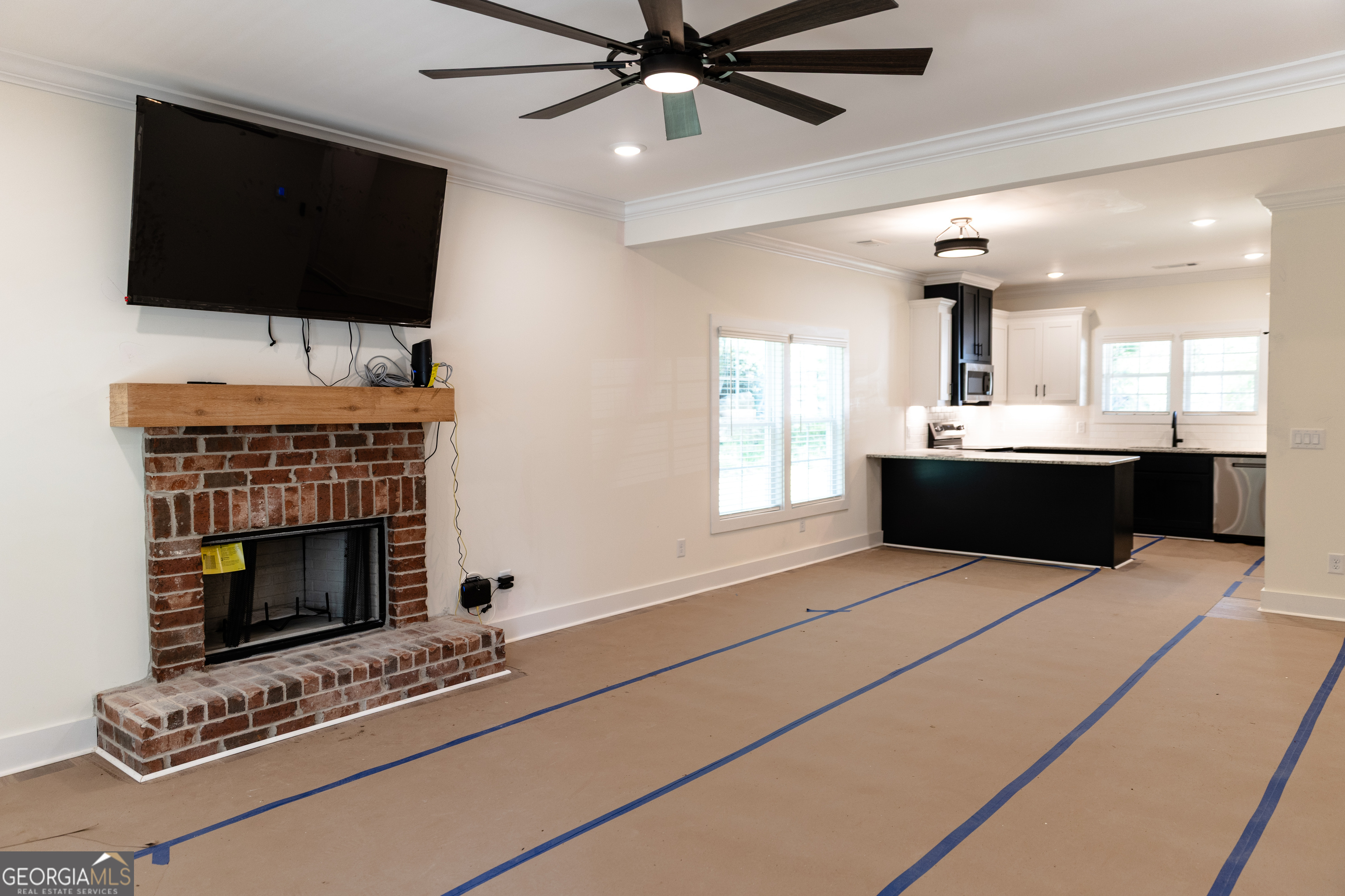 632 Campbell Road Covington, GA 30014 - Photo 7 of 60 a living room with fireplace furniture and a flat screen tv