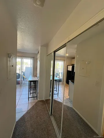a view of a livingroom with furniture and dining room