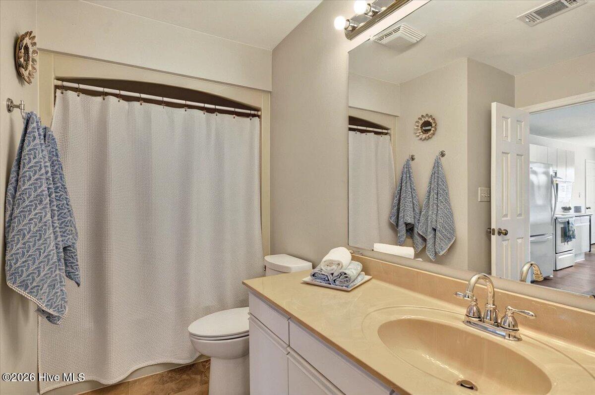816 Colony Place Southwest, Unit D Sunset Beach, NC 28468 - Photo 24 of 55 Shared guest and bedroom frull bath