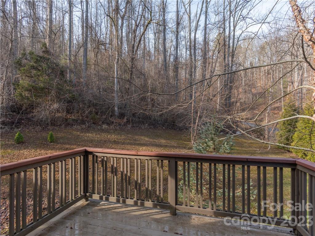 175 Red Oak Road Marshall, NC 28753 - Photo 18 of 34 a balcony with trees in front of it