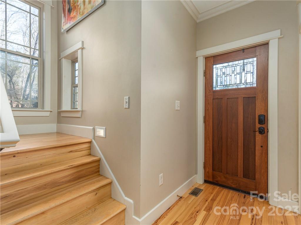 175 Red Oak Road Marshall, NC 28753 - Photo 2 of 34 a view of a hallway with wooden floor and staircase