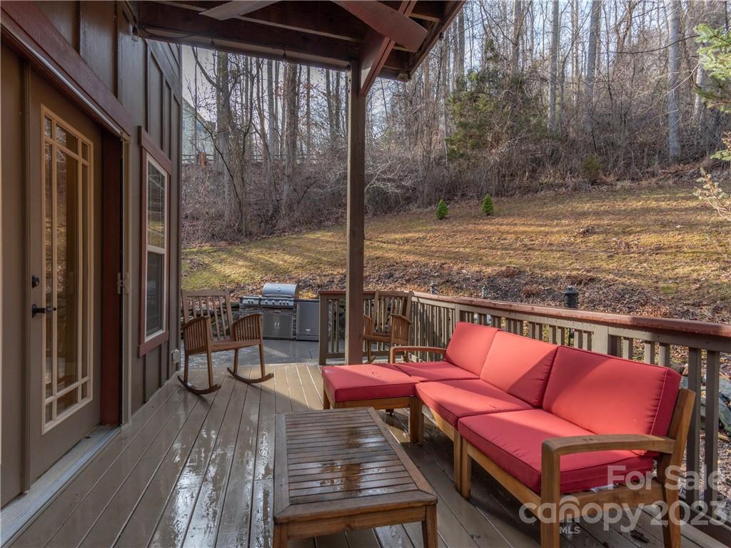 175 Red Oak Road Marshall, NC 28753 - Photo 24 of 34 a outdoor sitting area with furniture and wooden floor