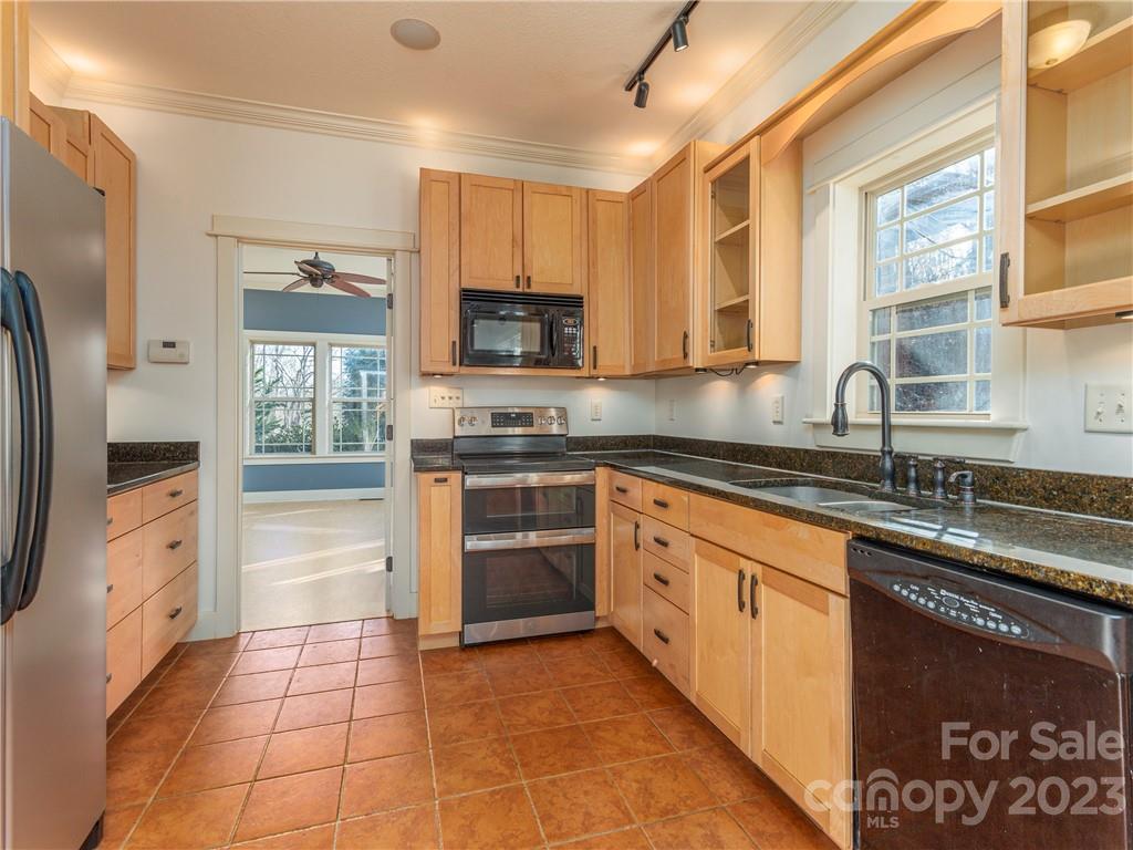 175 Red Oak Road Marshall, NC 28753 - Photo 9 of 34 a kitchen with stainless steel appliances granite countertop a stove a sink and a refrigerator