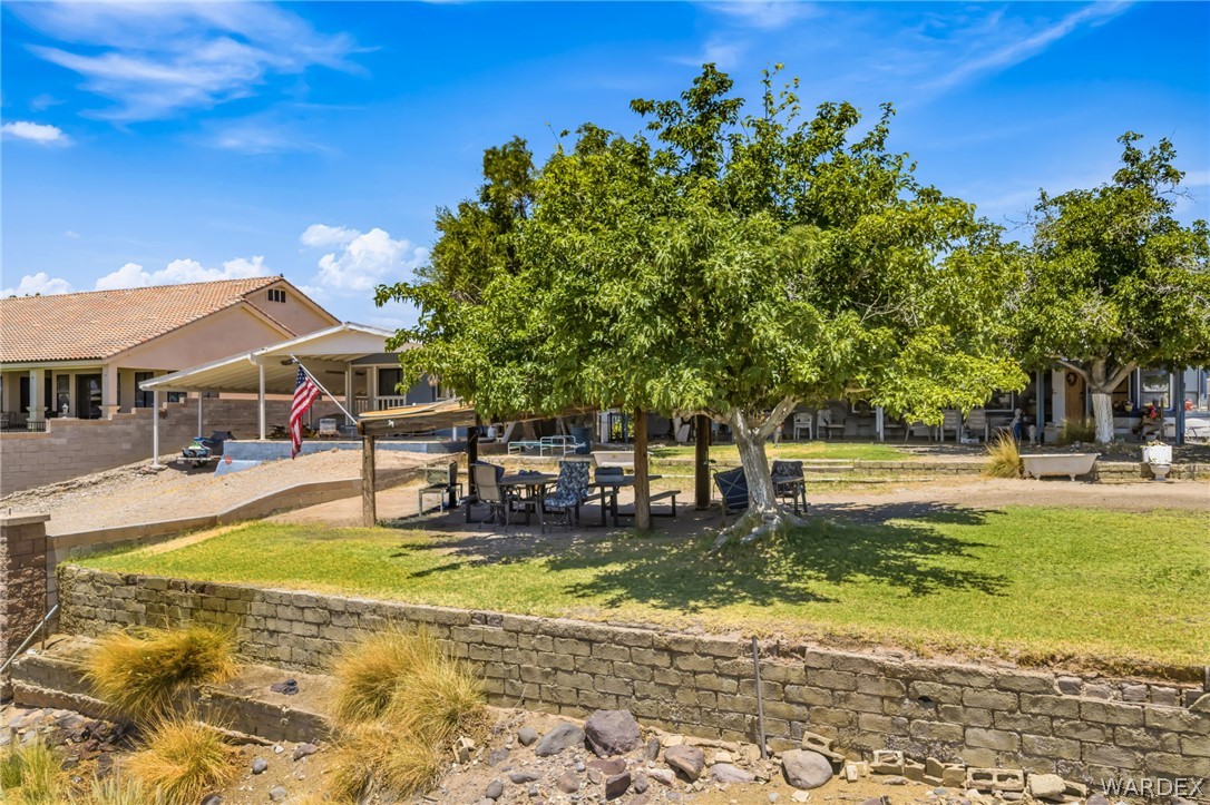 10031 Dike Road Mohave Valley, AZ 86440 - Photo 17 of 78 a swimming pool with outdoor seating and yard