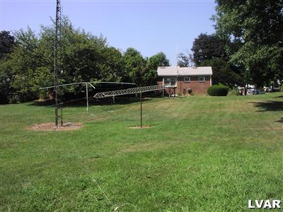 1454 Kelchner Road Bethlehem, PA 18018 - Photo 4 of 15 Rear View from Barn. Garage is behind trees. Ham radio antennas to be removed.
