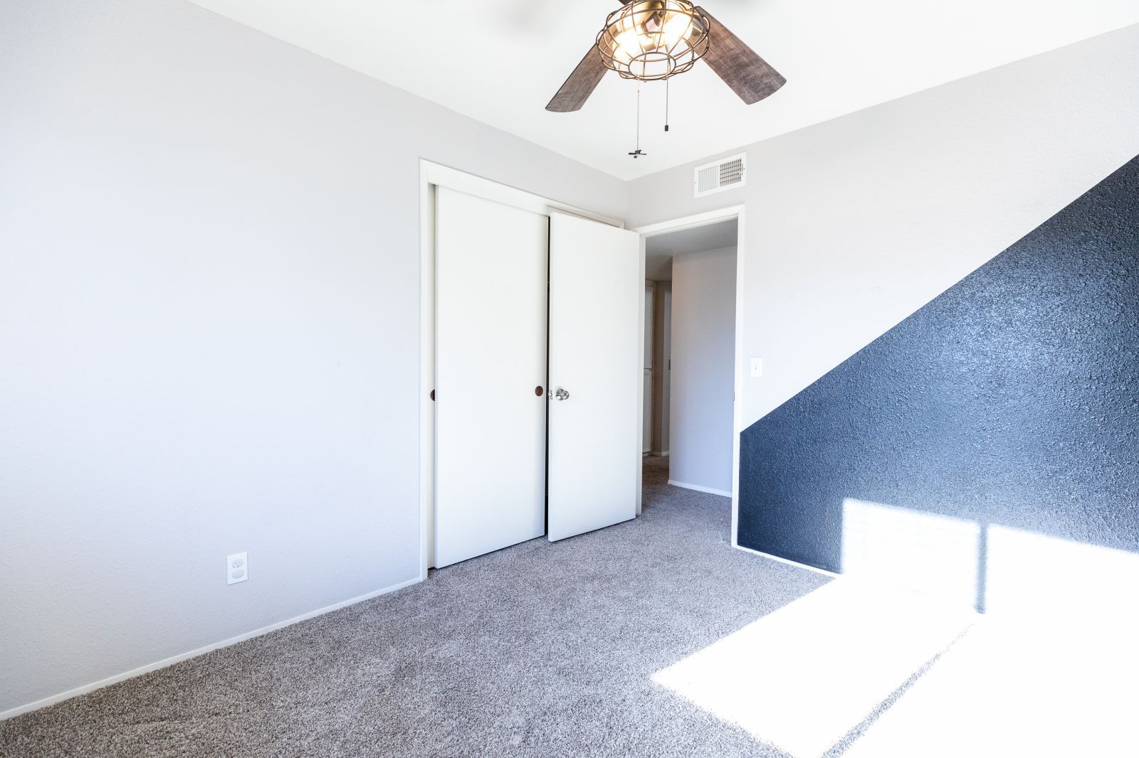 1960 Autumn Avenue Ridgecrest, CA 93555 - Photo 29 of 37 a view of a hallway with a white walls and chandelier