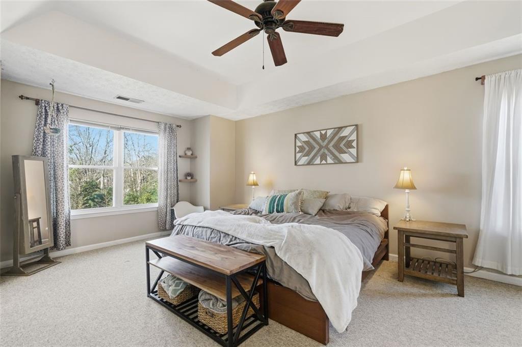 3295 Dundee Ridge Way Duluth, GA 30096 - Photo 15 of 34 a bedroom with a bed and a window