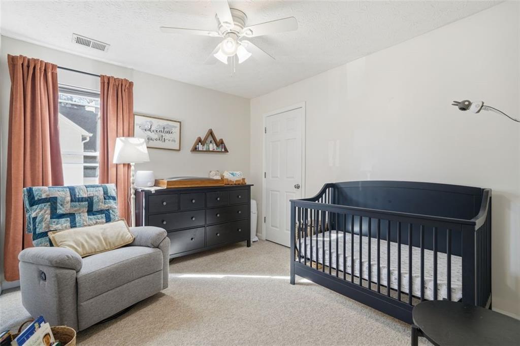 3295 Dundee Ridge Way Duluth, GA 30096 - Photo 19 of 34 a bedroom with furniture and a window