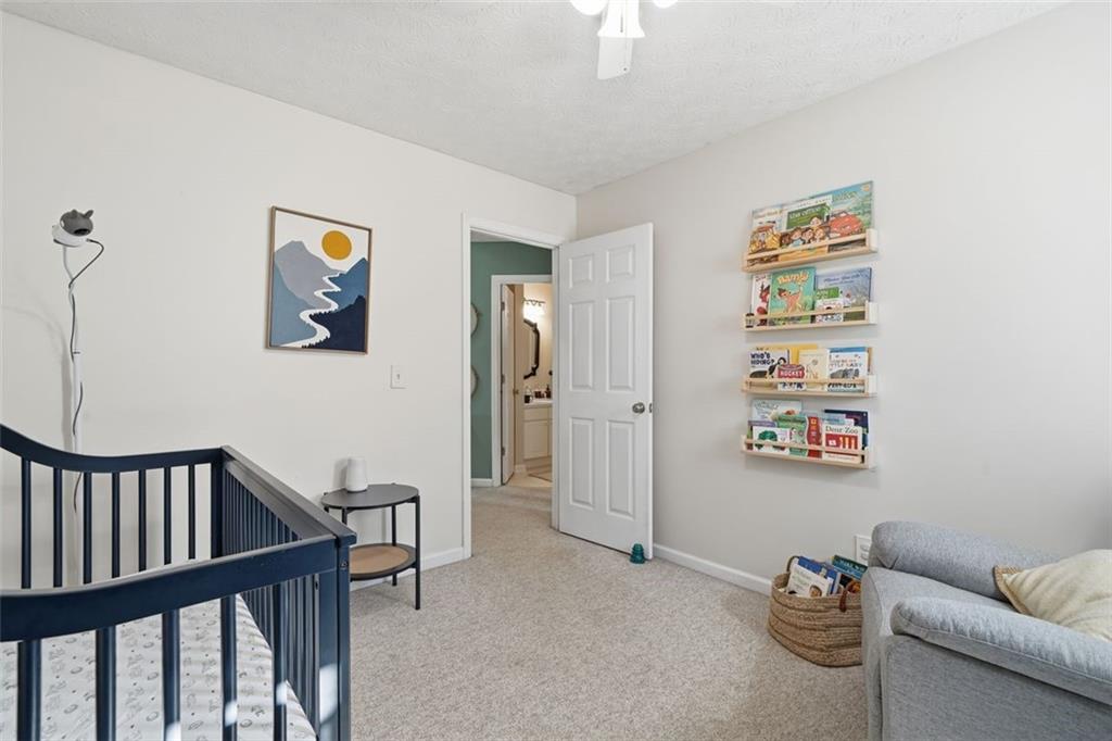 3295 Dundee Ridge Way Duluth, GA 30096 - Photo 20 of 34 a view of a hallway with workspace and a couch