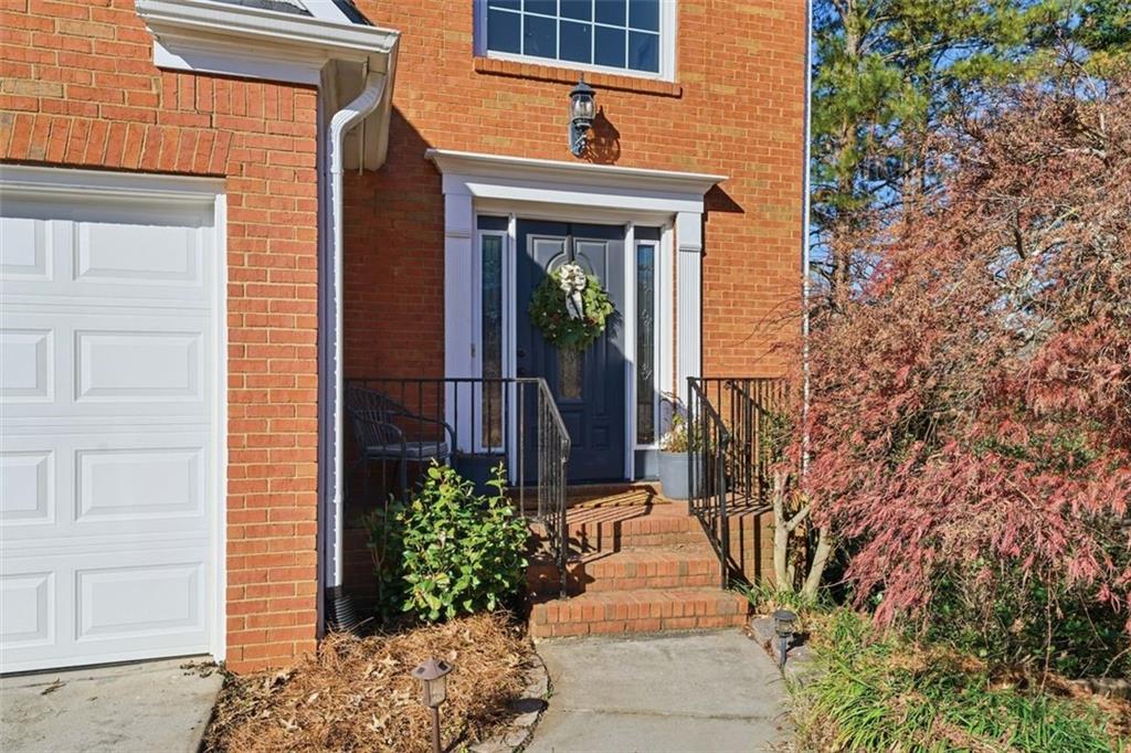 3295 Dundee Ridge Way Duluth, GA 30096 - Photo 2 of 34 a front view of a house with a yard