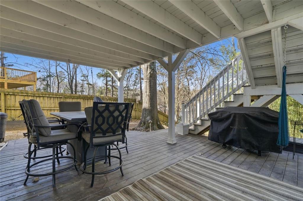 3295 Dundee Ridge Way Duluth, GA 30096 - Photo 28 of 34 a view of a patio with table and chairs and wooden floor