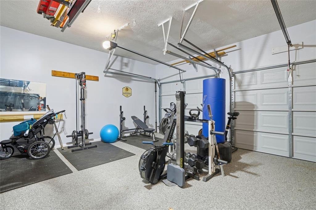 3295 Dundee Ridge Way Duluth, GA 30096 - Photo 30 of 34 a view of a room with gym equipment