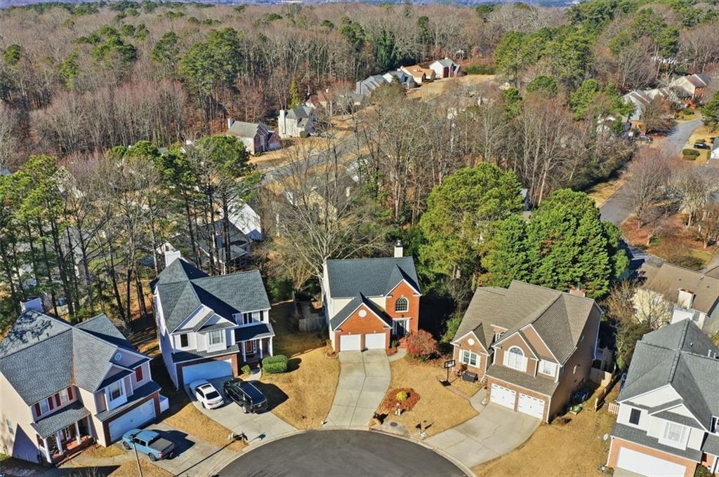 3295 Dundee Ridge Way Duluth, GA 30096 - Photo 32 of 34 an aerial view of a house with yard and mountain view