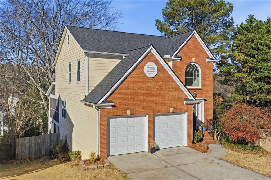 3295 Dundee Ridge Way Duluth, GA 30096 - Photo 33 of 34 a front view of a house with a yard