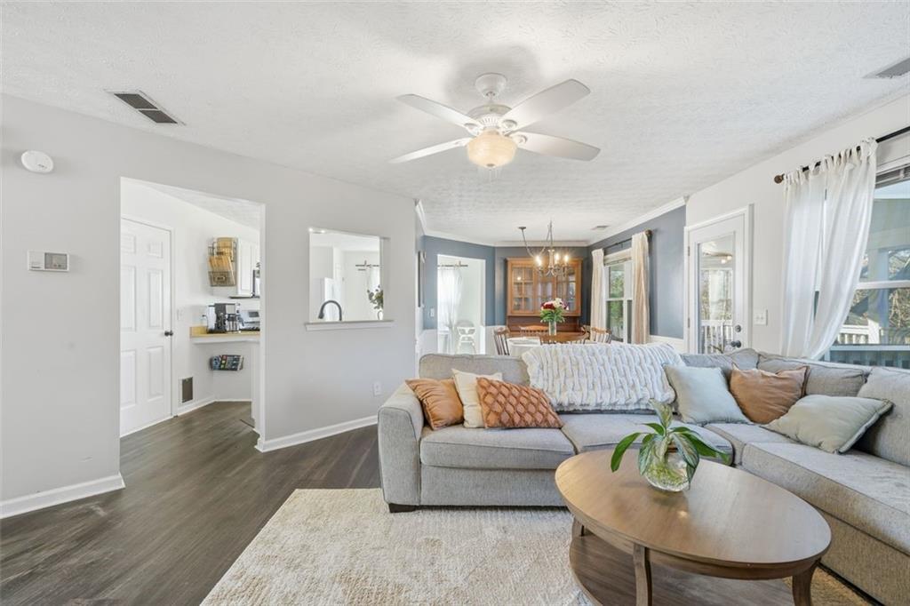 3295 Dundee Ridge Way Duluth, GA 30096 - Photo 7 of 34 a living room with furniture and a large window